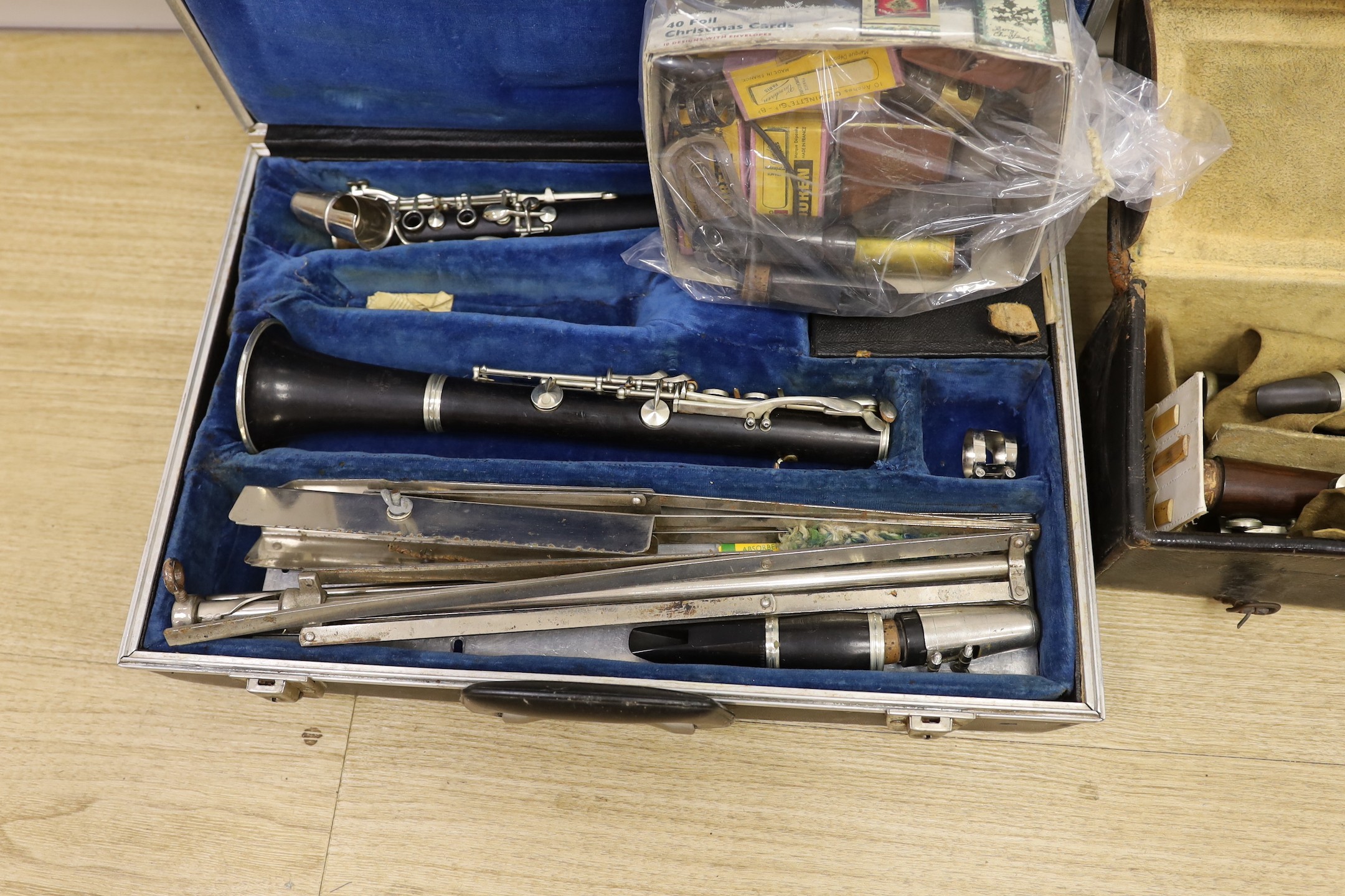 A French Buffet clarinet and two 19th century 'Simple System' clarinets, cased as one